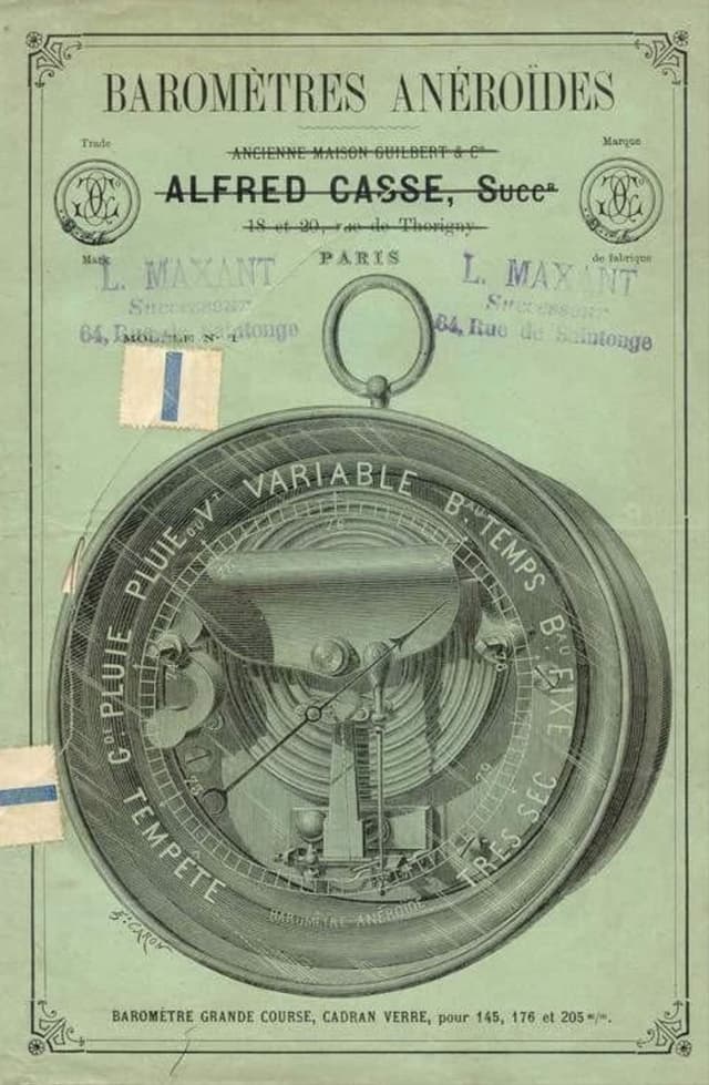 Early aneroid barometer on a wooden stand